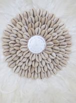 Close up white fluffy juju hat with cowrie shell centre style 2